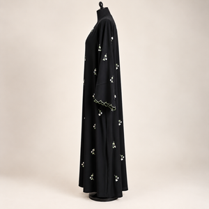Black embroidered closed abaya featuring delicate floral details with a matching scarf