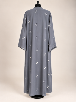 Back view of grey open abaya featuring delicate floral embroidery and matching scarf