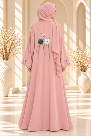 Close-up of 3D floral embroidery on a light pink open abaya with delicate back side