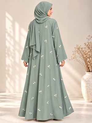 Back view of mint open abaya featuring delicate floral embroidery and matching scarf