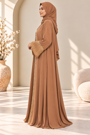 Side view of mocha abaya showcasing its elegant silhouette and organza balloon sleeves