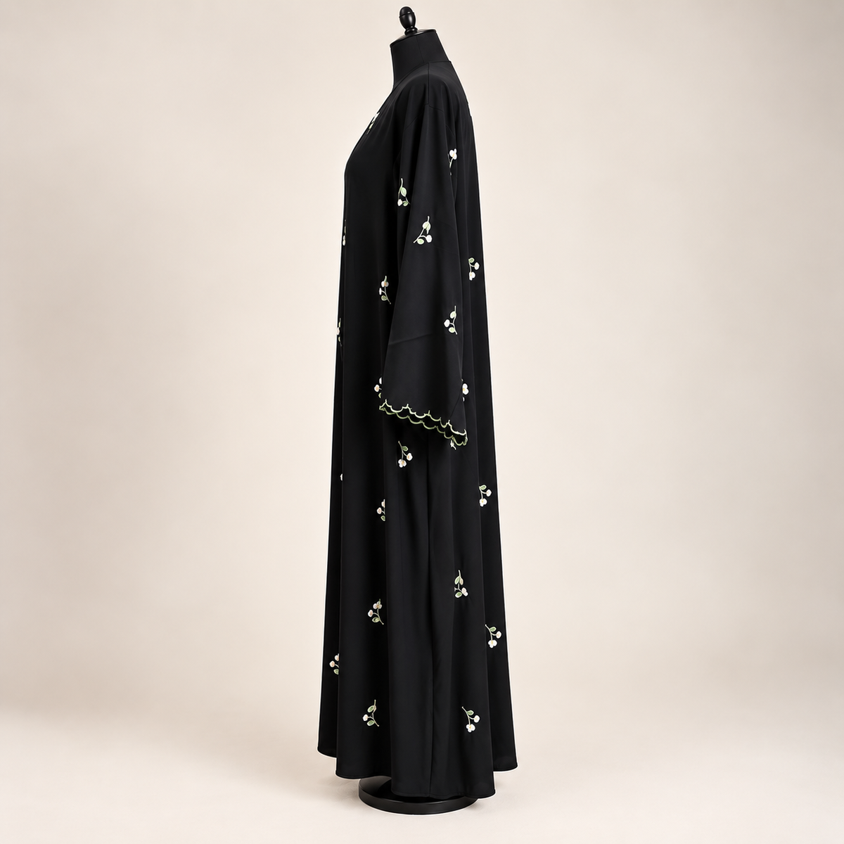 Black embroidered closed abaya featuring delicate floral details with a matching scarf