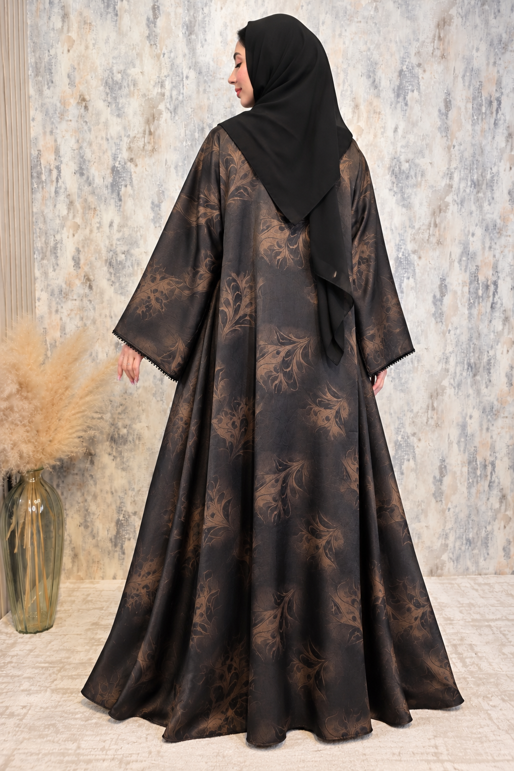 Back view of black flower-printed open abaya set featuring an elegant satin outer layer