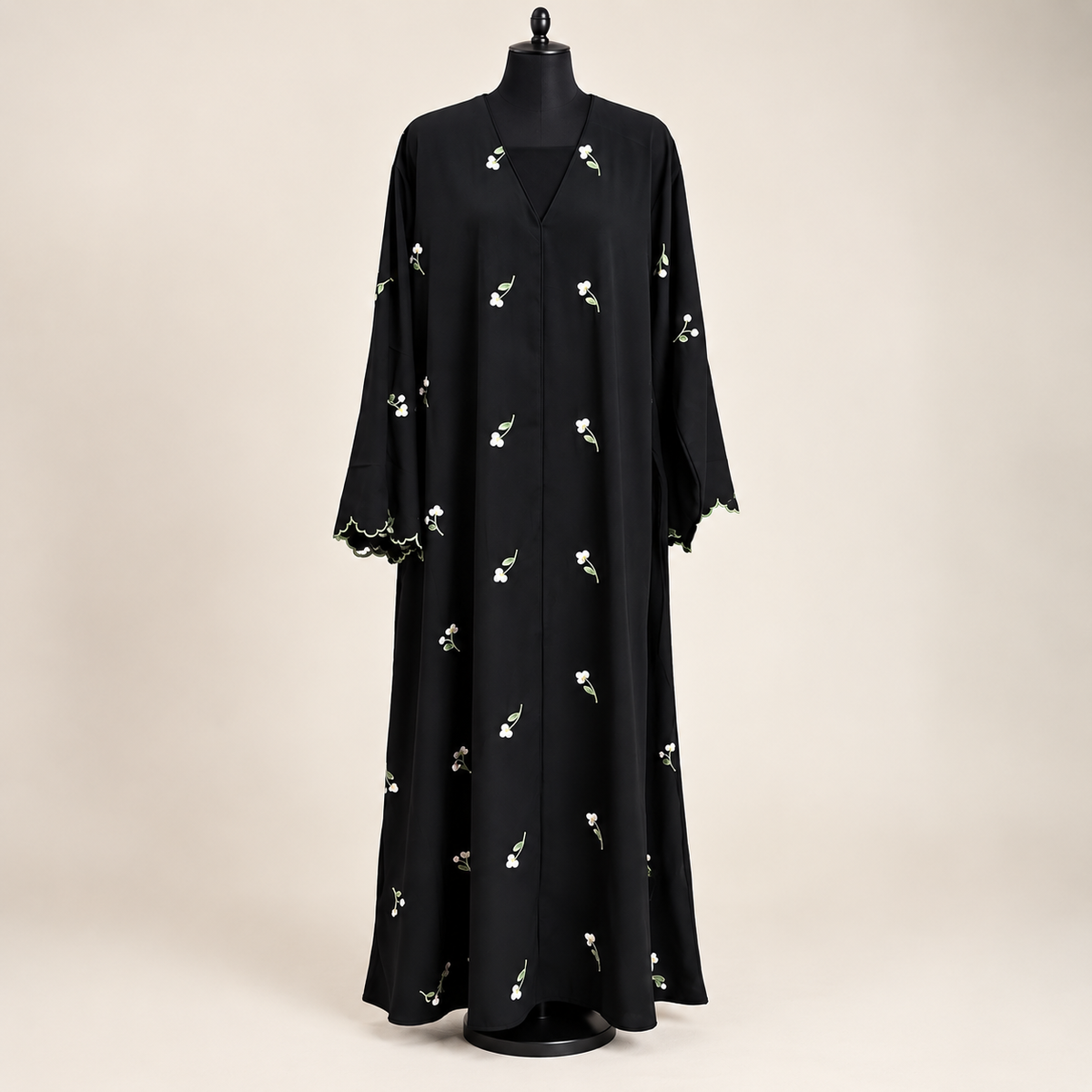 Women's black modest abaya with delicate floral embroidery and matching scarf