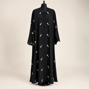 Women's black modest abaya with delicate floral embroidery and matching scarf