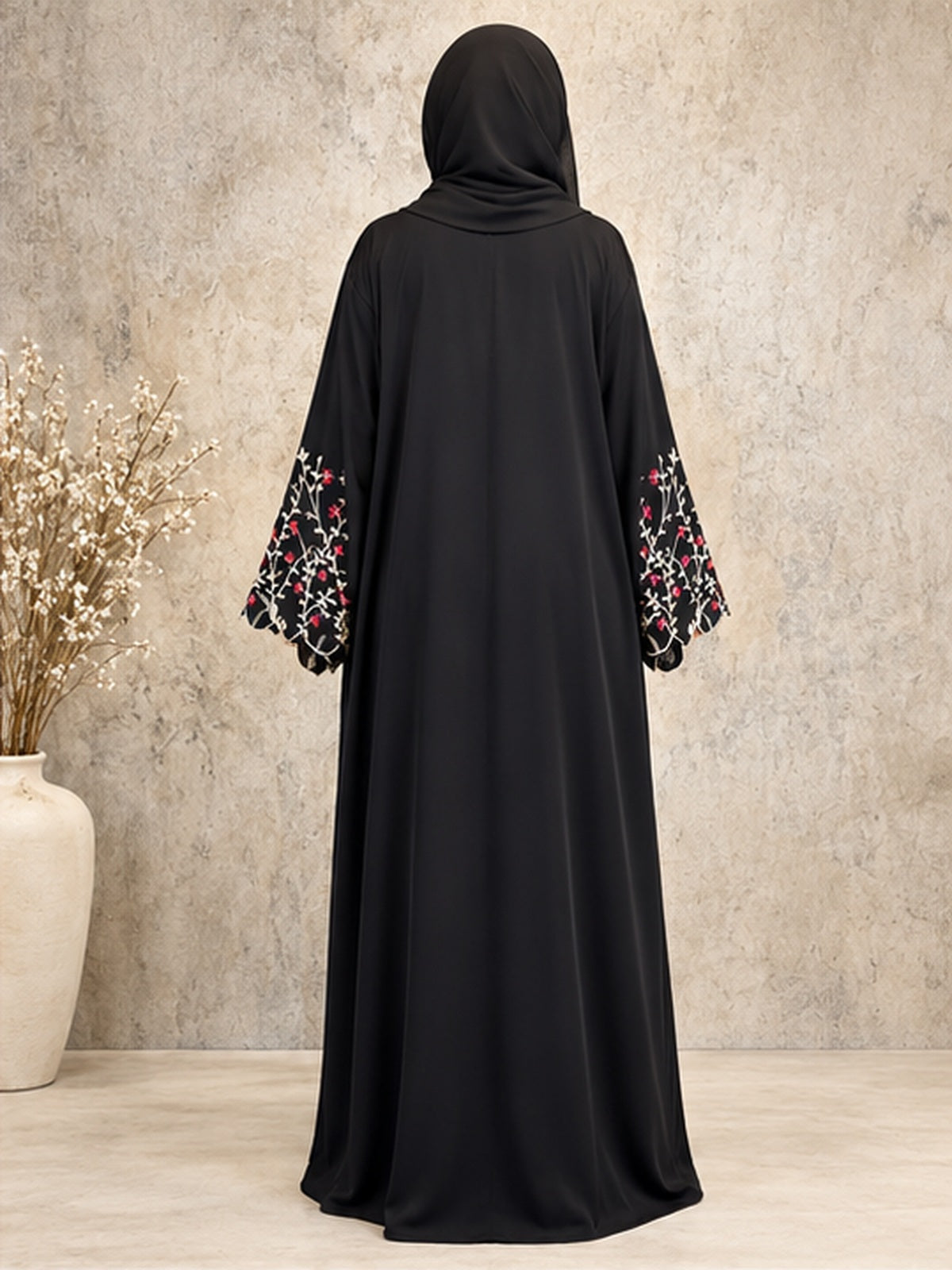 Back view of a premium black open abaya with floral embroidered sleeve detailing