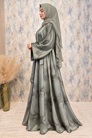 Side view of green open abaya with floral print, matching inner dress and coordinated scarf