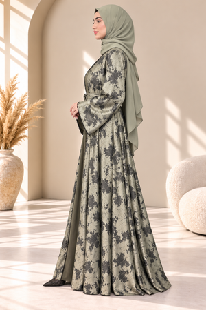 Side view of green Hafizah printed open abaya highlighting its elegant silhouette