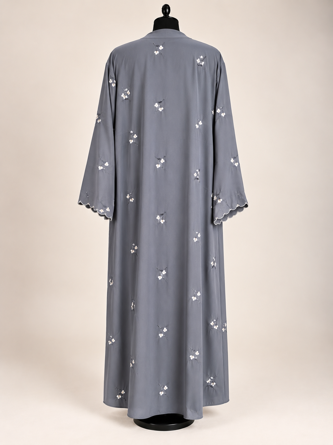 Back view of grey open abaya featuring delicate floral embroidery and matching scarf