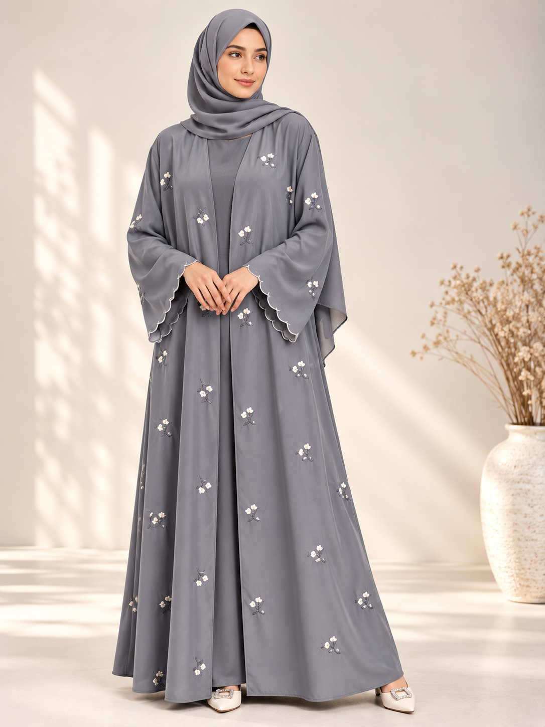 Side view of grey open abaya with elegant floral embroidery and matching scarf
