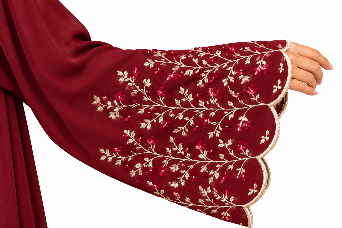 Hand view of a premium maroon open abaya with floral embroidered sleeve detailing