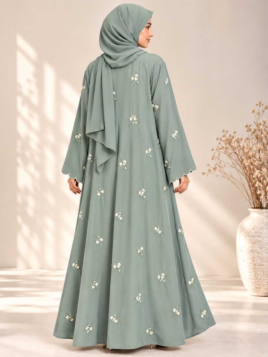 Back view of mint open abaya featuring delicate floral embroidery and matching scarf