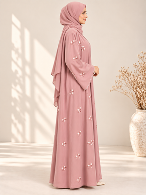 Side view of pink open abaya with elegant floral embroidery and matching scarf