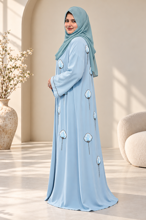 Side view of a premium icy-blue open abaya with 3D floral embroidery, intricate stone detailing and a matching hijab.